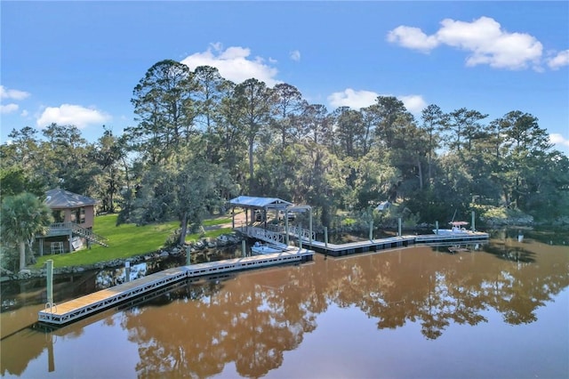 exterior space with a lawn and a water view