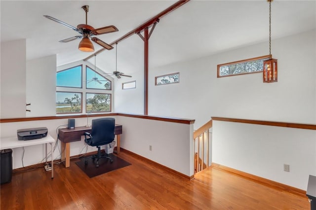 office space featuring ceiling fan, a wealth of natural light, high vaulted ceiling, and hardwood / wood-style flooring