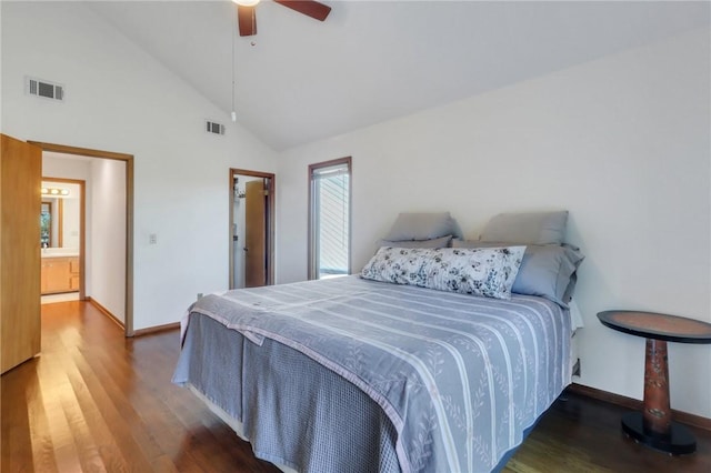 bedroom with high vaulted ceiling, ceiling fan, dark hardwood / wood-style flooring, and connected bathroom