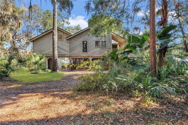 rear view of property featuring a carport