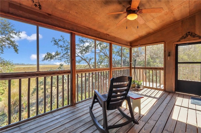 sunroom with ceiling fan, lofted ceiling, and wood ceiling