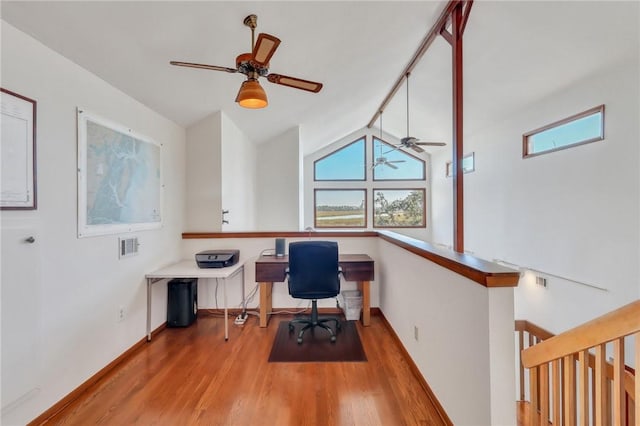 office featuring ceiling fan, light hardwood / wood-style floors, and lofted ceiling