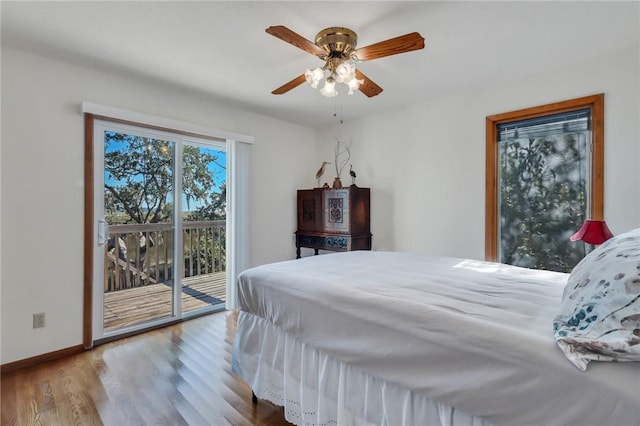 bedroom featuring access to outside, ceiling fan, and light hardwood / wood-style flooring