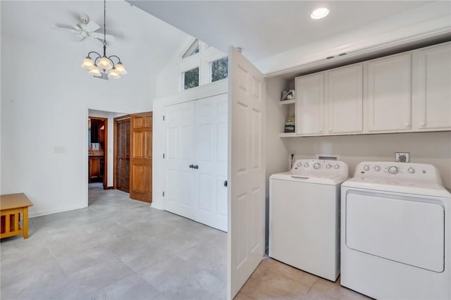 washroom featuring cabinets, a high ceiling, separate washer and dryer, and an inviting chandelier