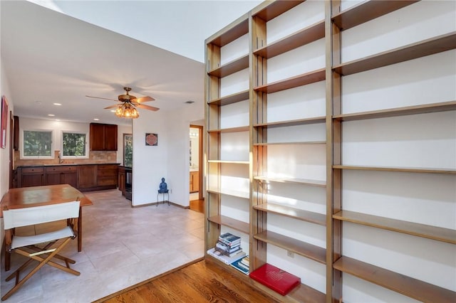 interior space featuring light hardwood / wood-style flooring and ceiling fan