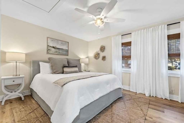 bedroom with hardwood / wood-style flooring and ceiling fan