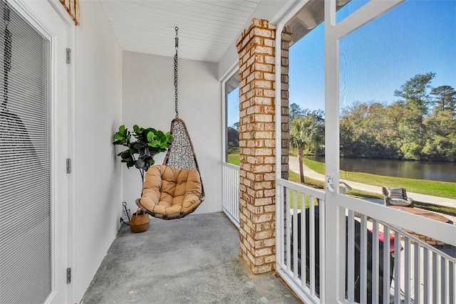 balcony featuring a water view