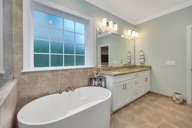 bathroom featuring crown molding, a bathtub, vanity, and tile walls