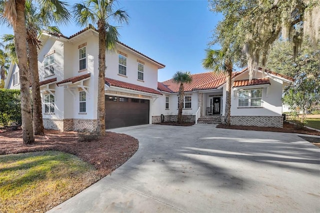 mediterranean / spanish house featuring a garage