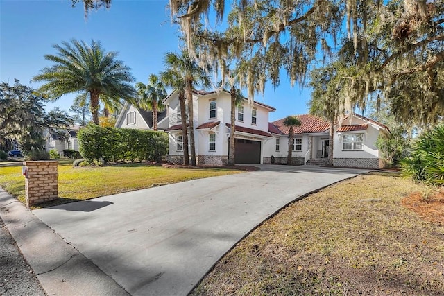 view of front of home featuring a garage and a front yard