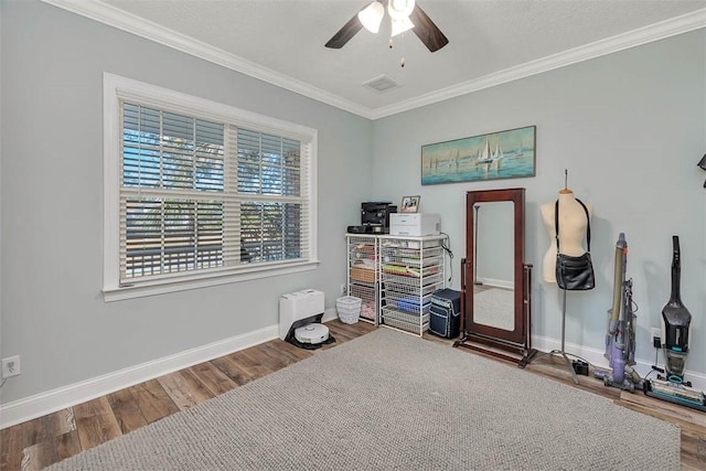 misc room featuring hardwood / wood-style floors, ceiling fan, and ornamental molding