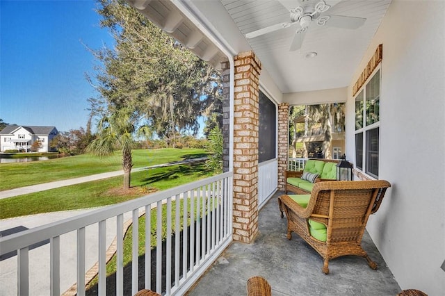 balcony with ceiling fan and covered porch