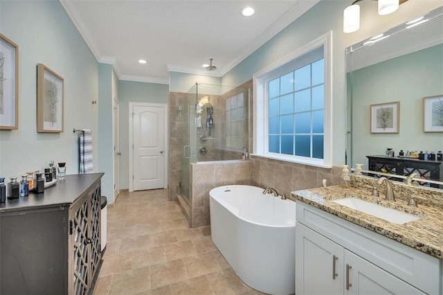 bathroom with vanity, crown molding, and independent shower and bath