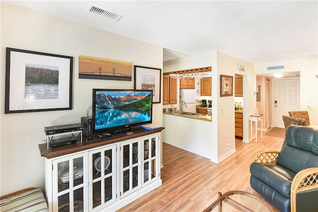 1524 Wood Ave Unit 314, Saint Simons Island, GA 31522 - living room with light wood-style floors and baseboards