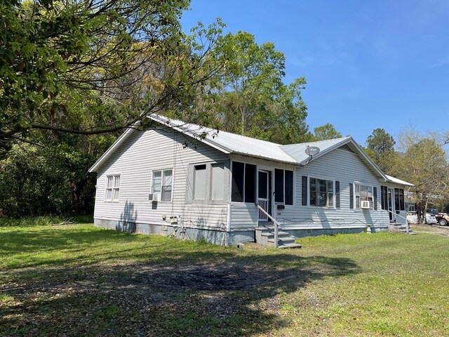 back of house with a yard