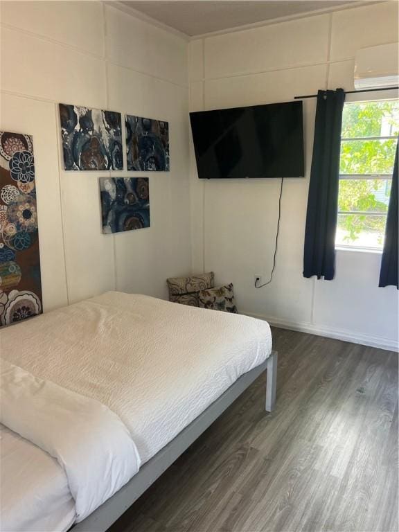 bedroom featuring dark wood-type flooring