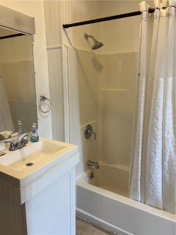 bathroom with vanity and shower / tub combo with curtain