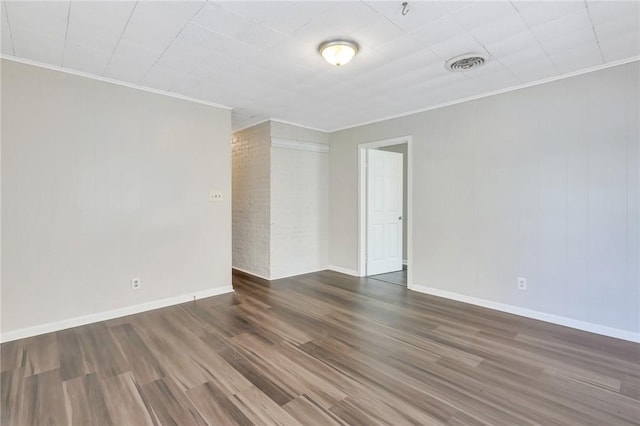 unfurnished room featuring crown molding and dark hardwood / wood-style floors