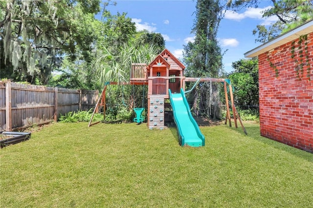 view of play area featuring a lawn