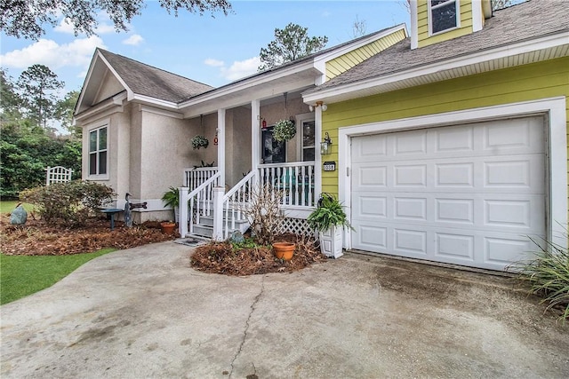 exterior space featuring a porch and a garage