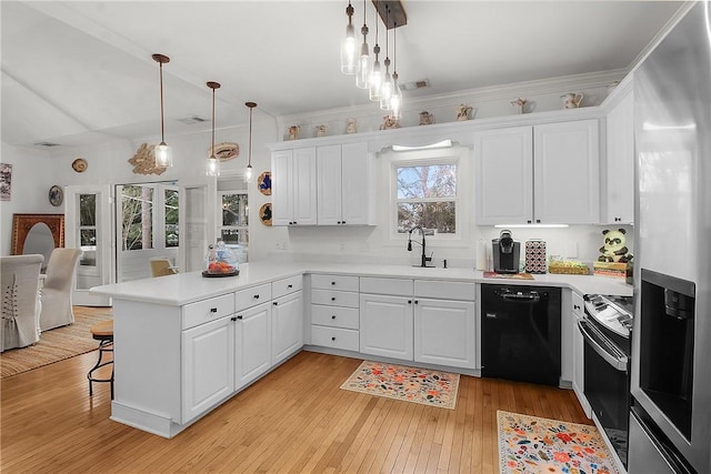 kitchen featuring pendant lighting, white cabinetry, kitchen peninsula, and black dishwasher