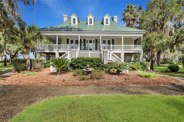 view of front facade featuring french doors and a porch