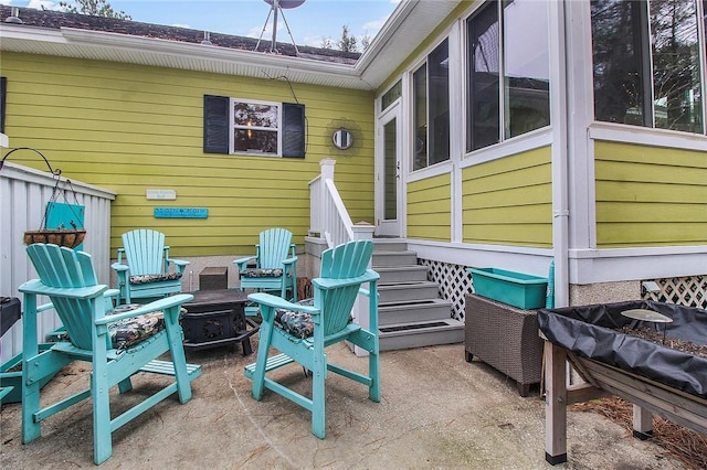 view of patio with an outdoor fire pit