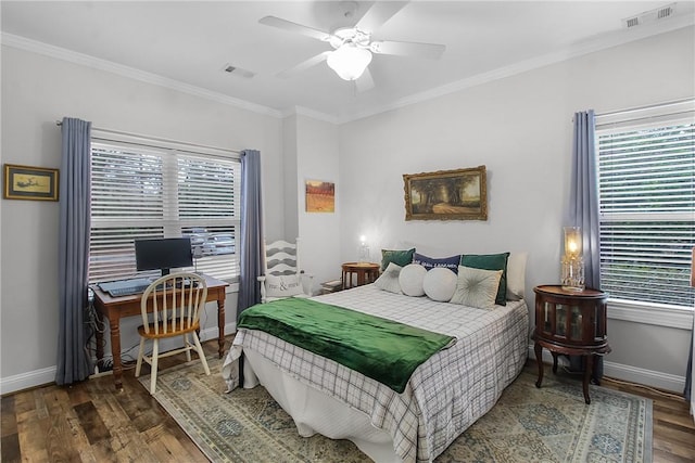 bedroom with multiple windows, ornamental molding, and dark wood-type flooring