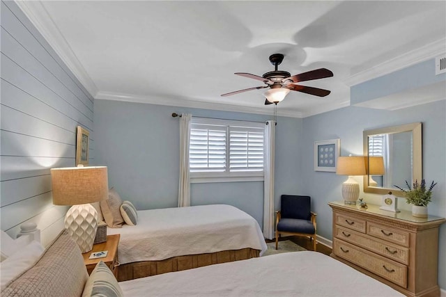 bedroom with ceiling fan and crown molding