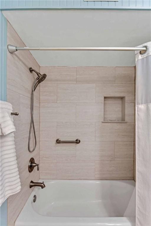 bathroom with shower / tub combo