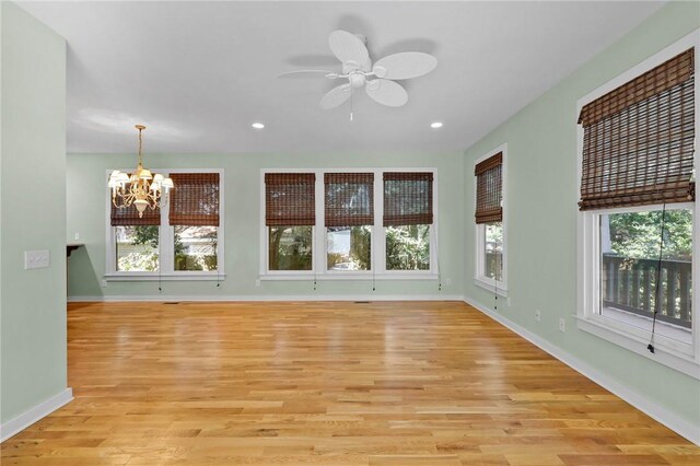 unfurnished living room featuring light hardwood / wood-style floors and a healthy amount of sunlight