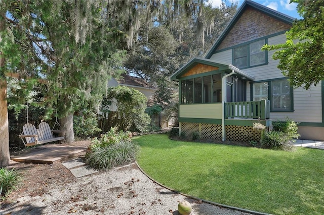 view of yard with a sunroom