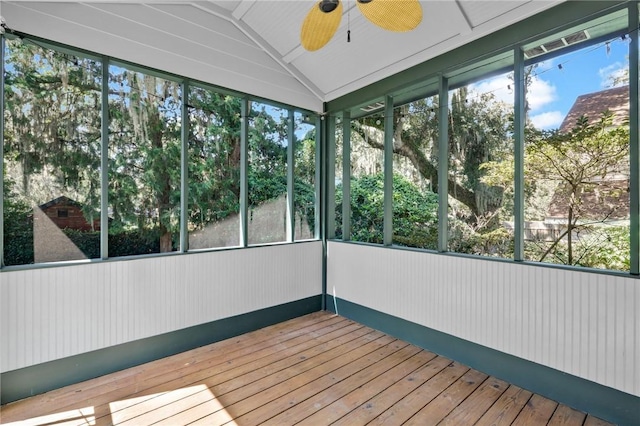 unfurnished sunroom with ceiling fan and lofted ceiling