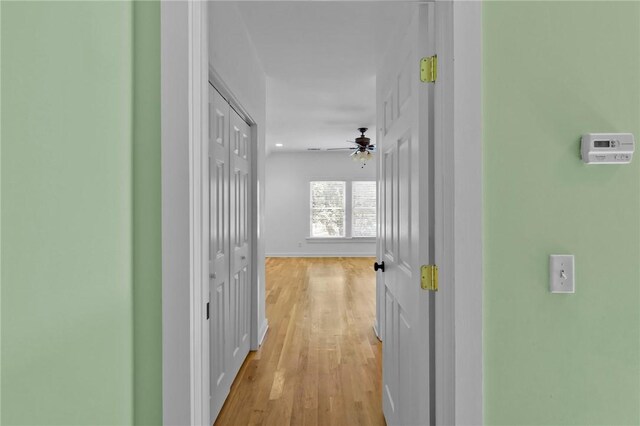 corridor with light hardwood / wood-style flooring