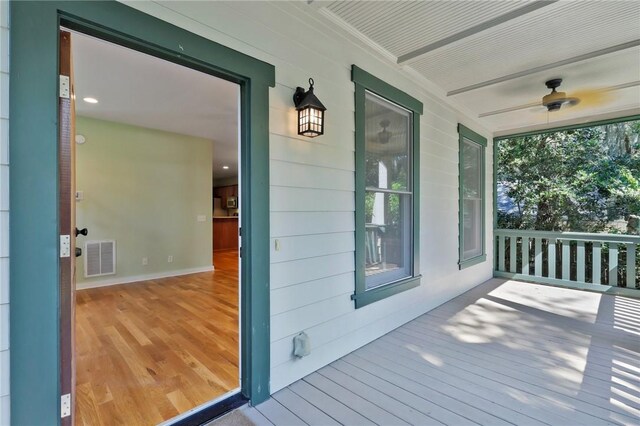 wooden deck with ceiling fan