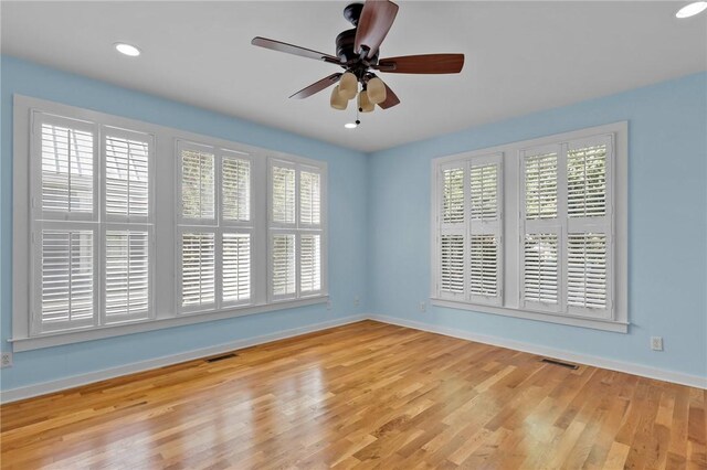 spare room with light hardwood / wood-style flooring and ceiling fan