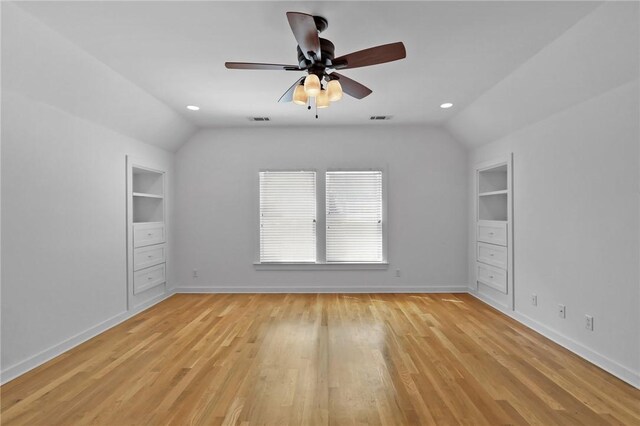 unfurnished bedroom featuring ceiling fan, lofted ceiling, and light hardwood / wood-style flooring