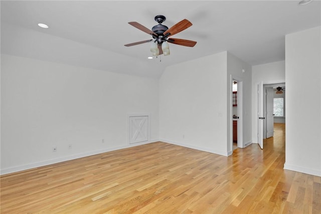 spare room featuring ceiling fan and light hardwood / wood-style flooring