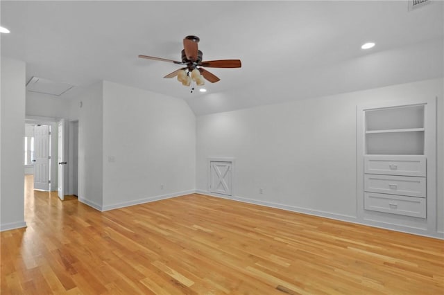 interior space featuring lofted ceiling, ceiling fan, light hardwood / wood-style flooring, and built in features