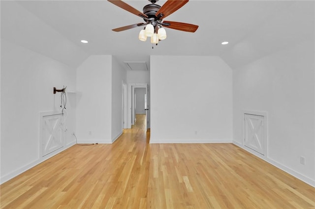 additional living space featuring lofted ceiling, ceiling fan, and light wood-type flooring