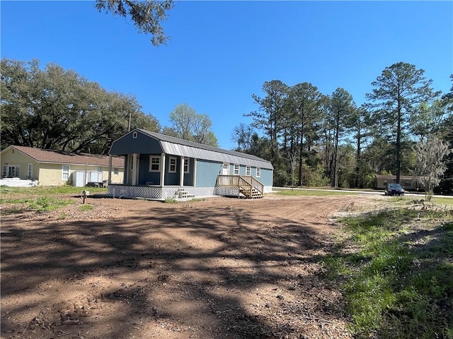 view of property exterior featuring a gambrel roof