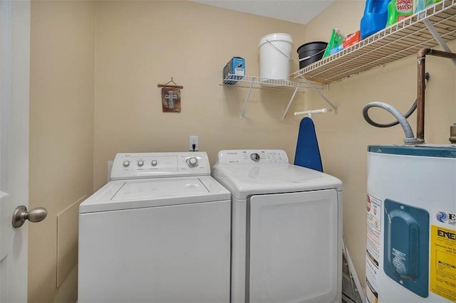 laundry area featuring washer and dryer and electric water heater