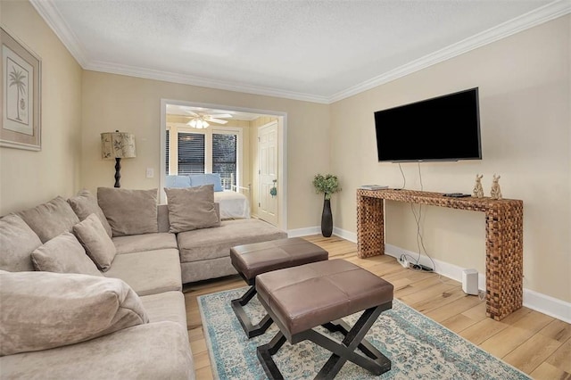 living room with ornamental molding, hardwood / wood-style floors, ceiling fan, and a textured ceiling