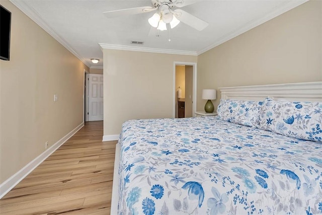 bedroom featuring hardwood / wood-style flooring, ornamental molding, and ceiling fan