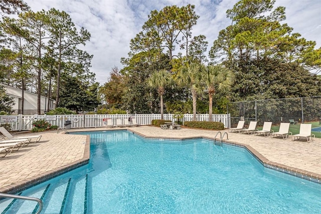 view of swimming pool with a patio area