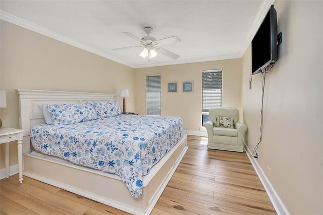 bedroom featuring wood-type flooring, ceiling fan, and crown molding