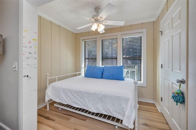 bedroom with hardwood / wood-style floors and ceiling fan