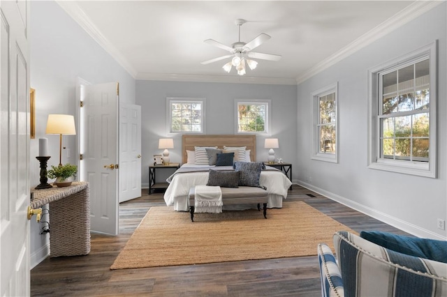 bedroom featuring ceiling fan, ornamental molding, and dark hardwood / wood-style floors