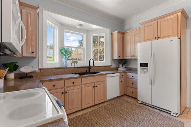 kitchen featuring light tile patterned floors, sink, white appliances, and light brown cabinets