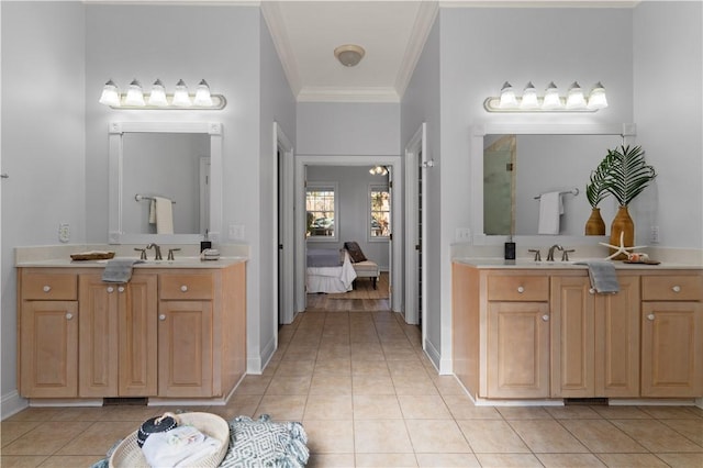 bathroom featuring vanity, tile patterned floors, and crown molding